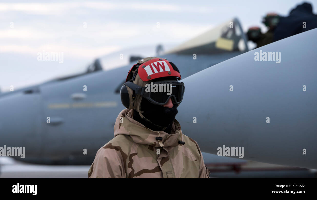 A U S Navy Maintainer With Strike Fighter Squadron 106 Communicates With A Pilot Before Takeoff