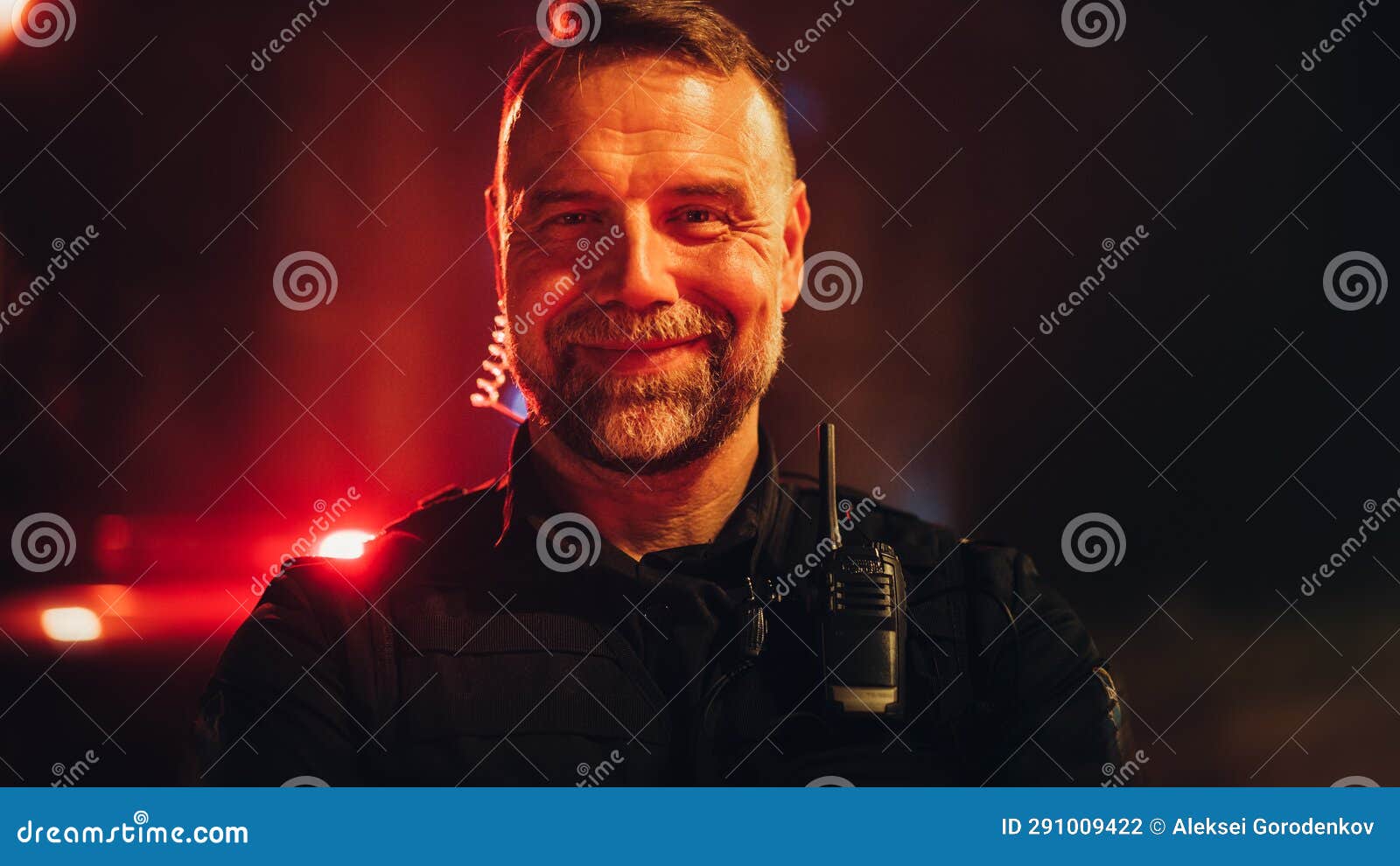 Portrait Of Police Officer Looking At The Camera And Smiling Friendly